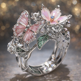 Skinnende ring i form af en sommerfugl med zirkon